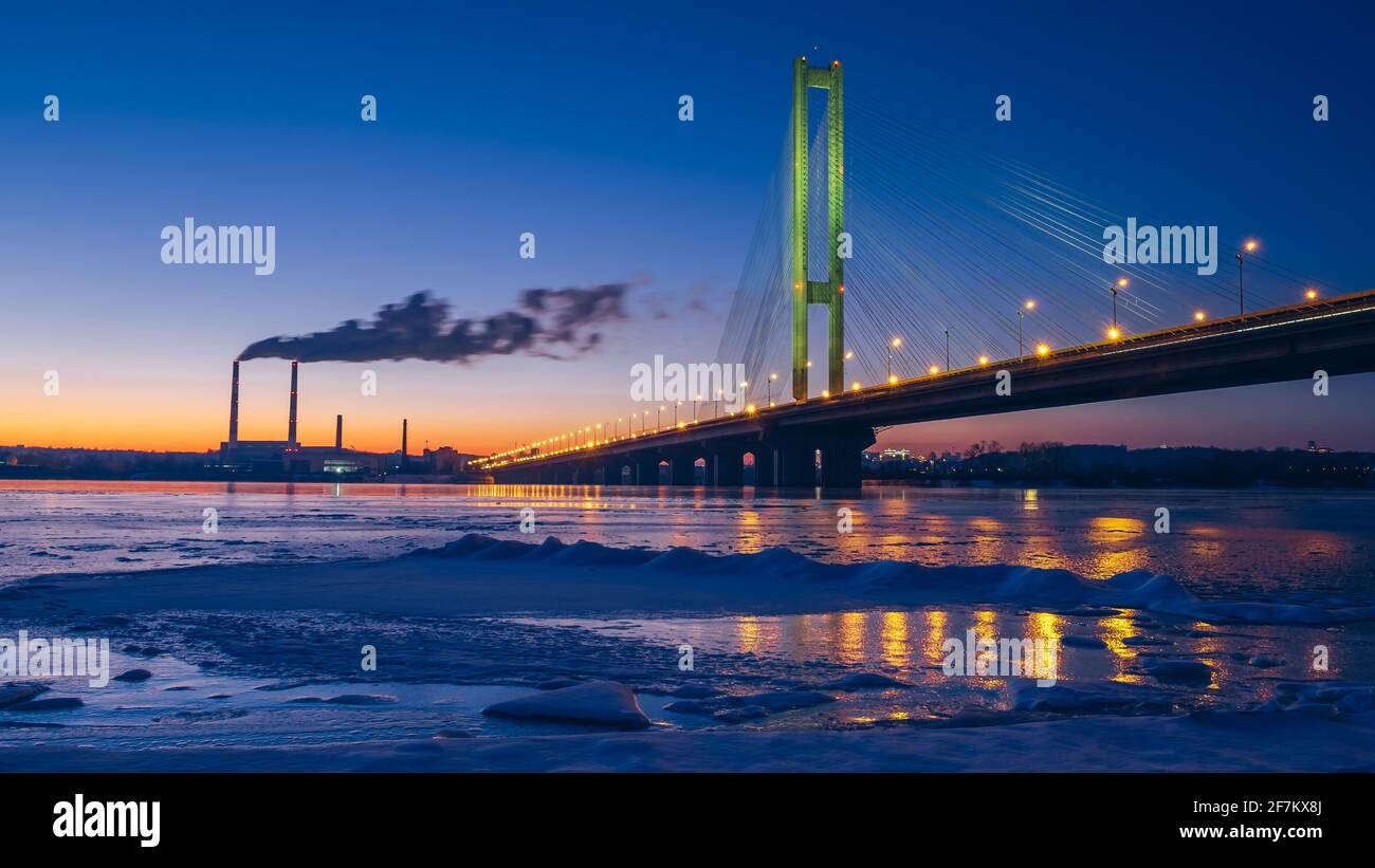 Smog from a power plant near the Dnipro river on night city background, Kiev, Ukraine. Air pollution concept Stock Photo