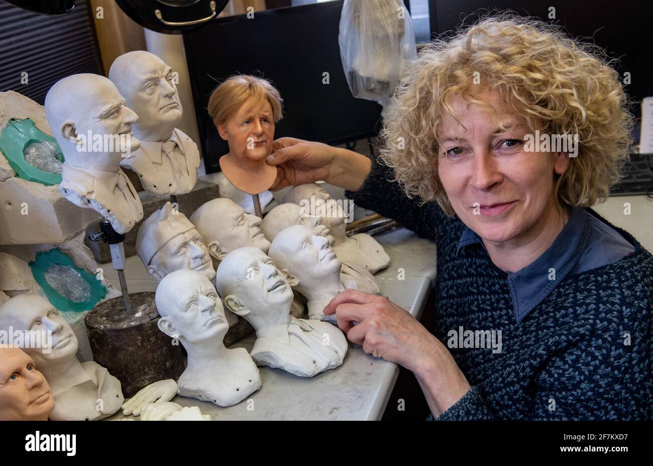 Lichtenstein, Germany. 08th Apr, 2021. In her workshop in Lichtenstein, Brigitte Schneider is busy working on portrait heads. In her studio she makes elaborate hand puppets, busts and marionettes. Among the sculptures are many prominent faces that celebrate their grand entrance in political cabaret or puppet theatre, for example. Credit: Hendrik Schmidt/dpa-Zentralbild/ZB/dpa/Alamy Live News Stock Photo