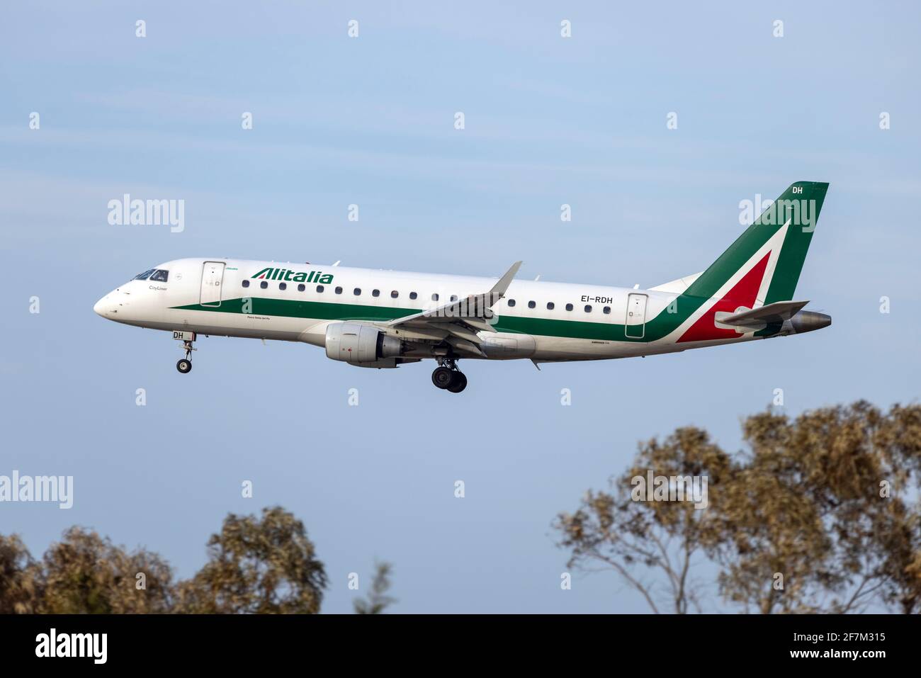 Alitalia CityLiner Embraer 175STD (REG: EI-RDH) on short finals, arriving from Rome, Fiumicino. Stock Photo