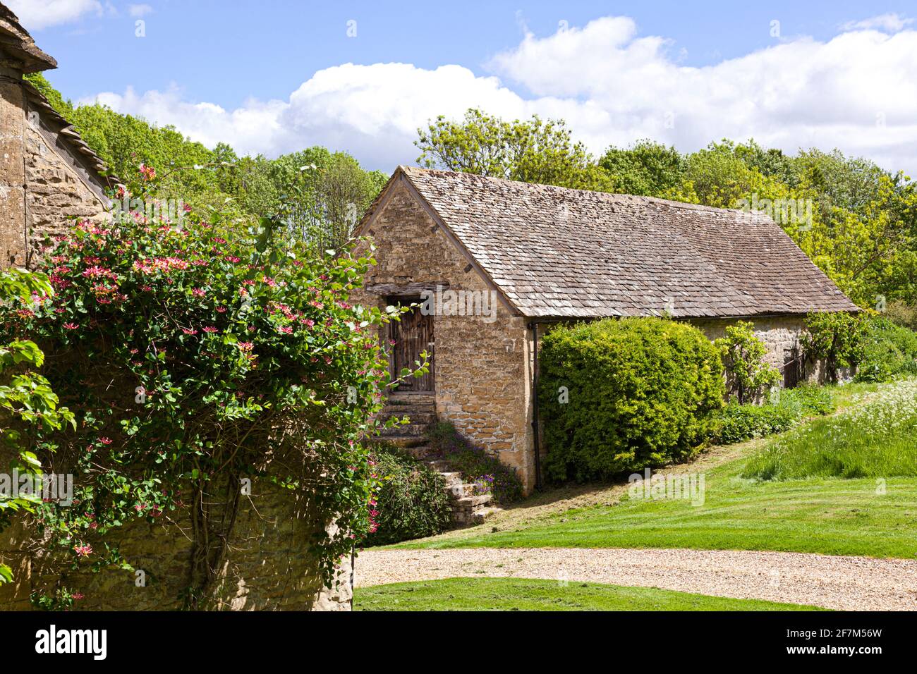 A Cotswold stone barn in the Cotswold village of Duntisbourne Leer, Gloucestershire UK Stock Photo