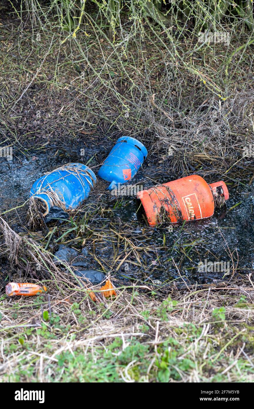 Fly tipped rubbish and gas bottles dumped in the Cambridgeshire Countryside UK Stock Photo