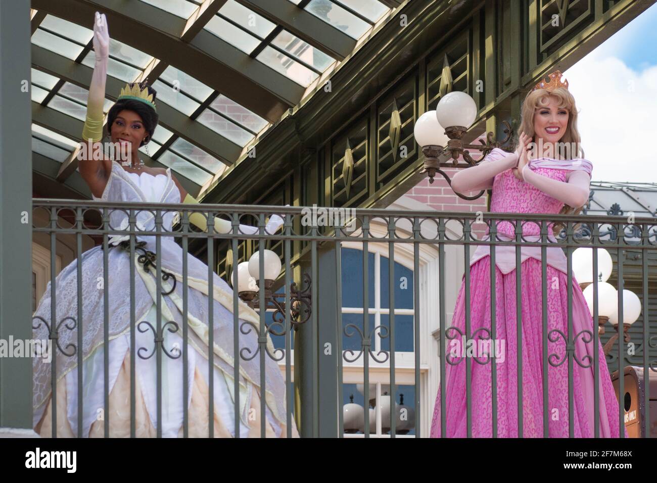 Orlando, Florida. August 04, 2020. Thiana and Aurora waving from the balcony at Walt Disney World Railroad at Magic 399 Stock Photo