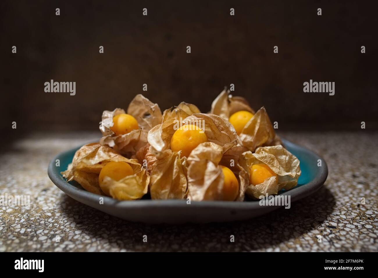 Heap of Golden Berries on ceramic dish Stock Photo