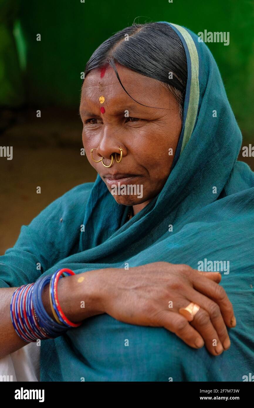 Kunduli, India - February 2021: Portrait of adivasi woman from the Kondh tribe in the Kunduli market on February 19, 2021 in Odisha, India. Stock Photo