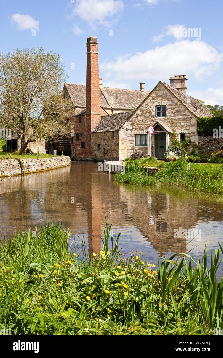 The Old Mill on the River Eye flowing through the Cotswold village of Lower Slaughter, Gloucestershire UK Stock Photo