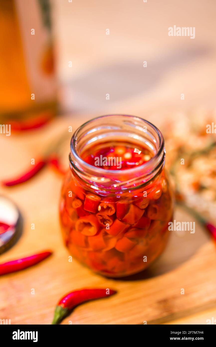 Pickle red chilli peppers with vinegar in glass jar Stock Photo Alamy