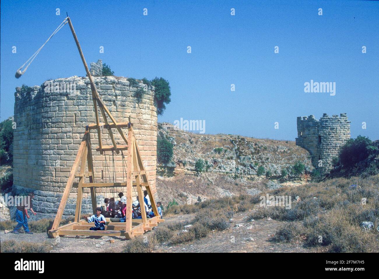 Modern replica crusader siege trebuchet or catapult aided by local village people Koz Castle Turkey Stock Photo