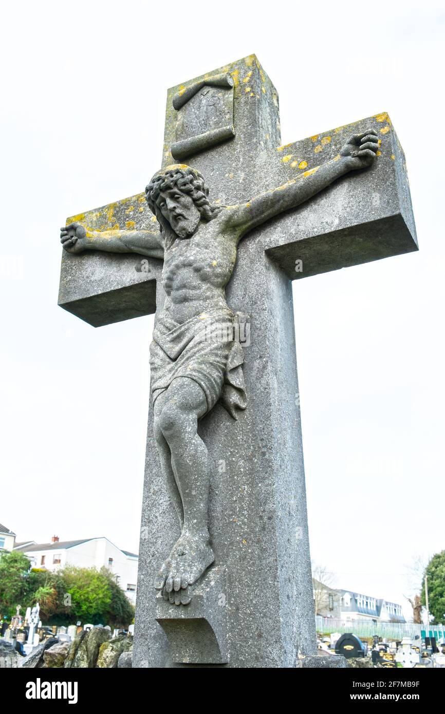 A realistic sculpture representation of Christ on the cross in an old Irish graveyard Stock Photo