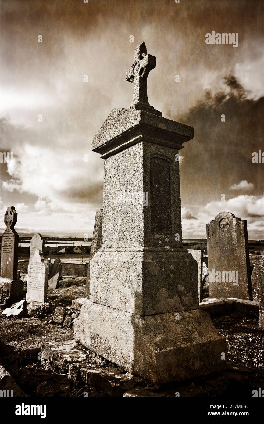 An imposing sturdy memorial grave stone in an Irish graveyard Stock