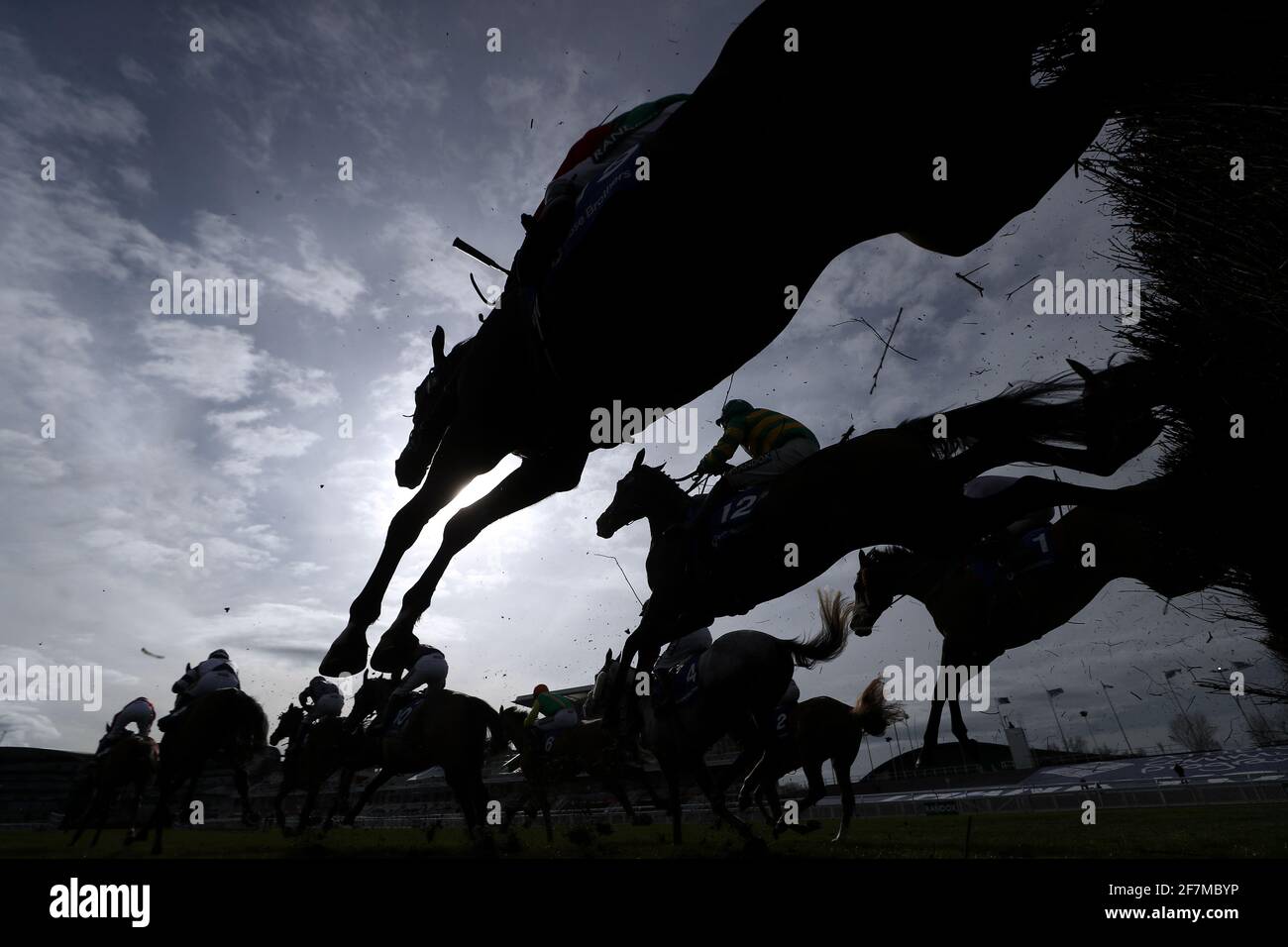 Runners and riders clear a fence during the Close Brothers Red Rum Handicap Chase on Liverpool NHS Day of the 2021 Randox Health Grand National Festival at Aintree Racecourse, Liverpool. Picture date: Thursday April 8, 2021. Stock Photo