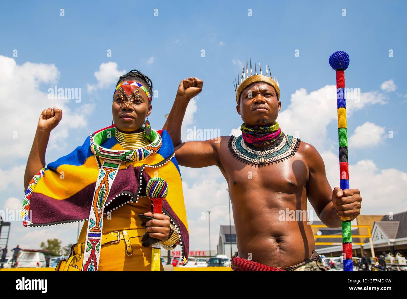 Johannesburg, South Africa. 08th Apr, 2021. Activist Nqobile Maluku (L) and Thando Mahlangu (R) wearing traditional attire raise their fists during a protest outside the Boulders Shopping Centre, after a store manager asked a man to leave for being dressed in the traditional Ndebele attire. (Photo by Thabo Jaiyesimi/SOPA Images/Sipa USA) Credit: Sipa USA/Alamy Live News Stock Photo
