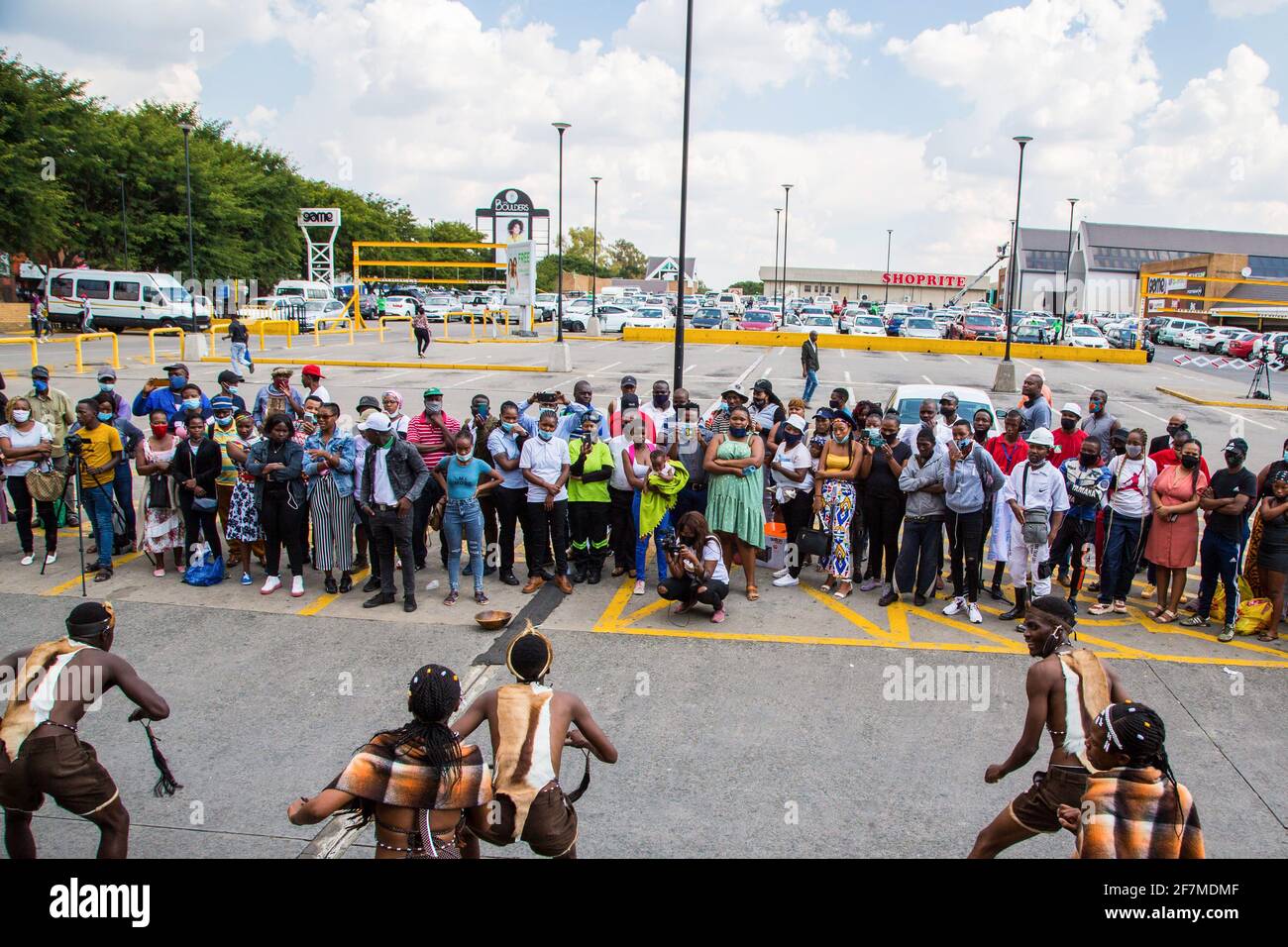 Johannesburg, South Africa. 08th Apr, 2021. People look on as demonstrators dressed in traditional attire dance during a protest outside the Boulders Shopping Centre, after a store manager asked a man to leave for being dressed in the traditional Ndebele attire. (Photo by Thabo Jaiyesimi/SOPA Images/Sipa USA) Credit: Sipa USA/Alamy Live News Stock Photo
