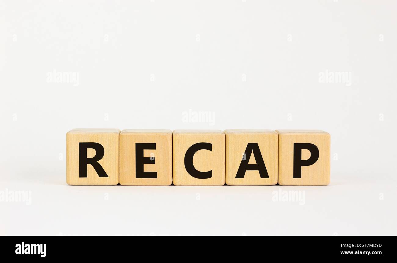 Recap symbol. The concept word 'recap' on wooden cubes on beautiful