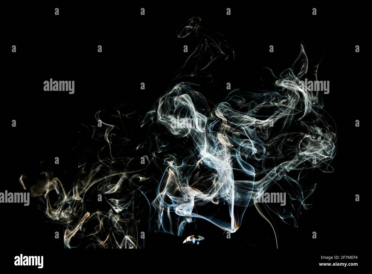 Grey smoke abstract texture, isolated effect with dark background Stock Photo
