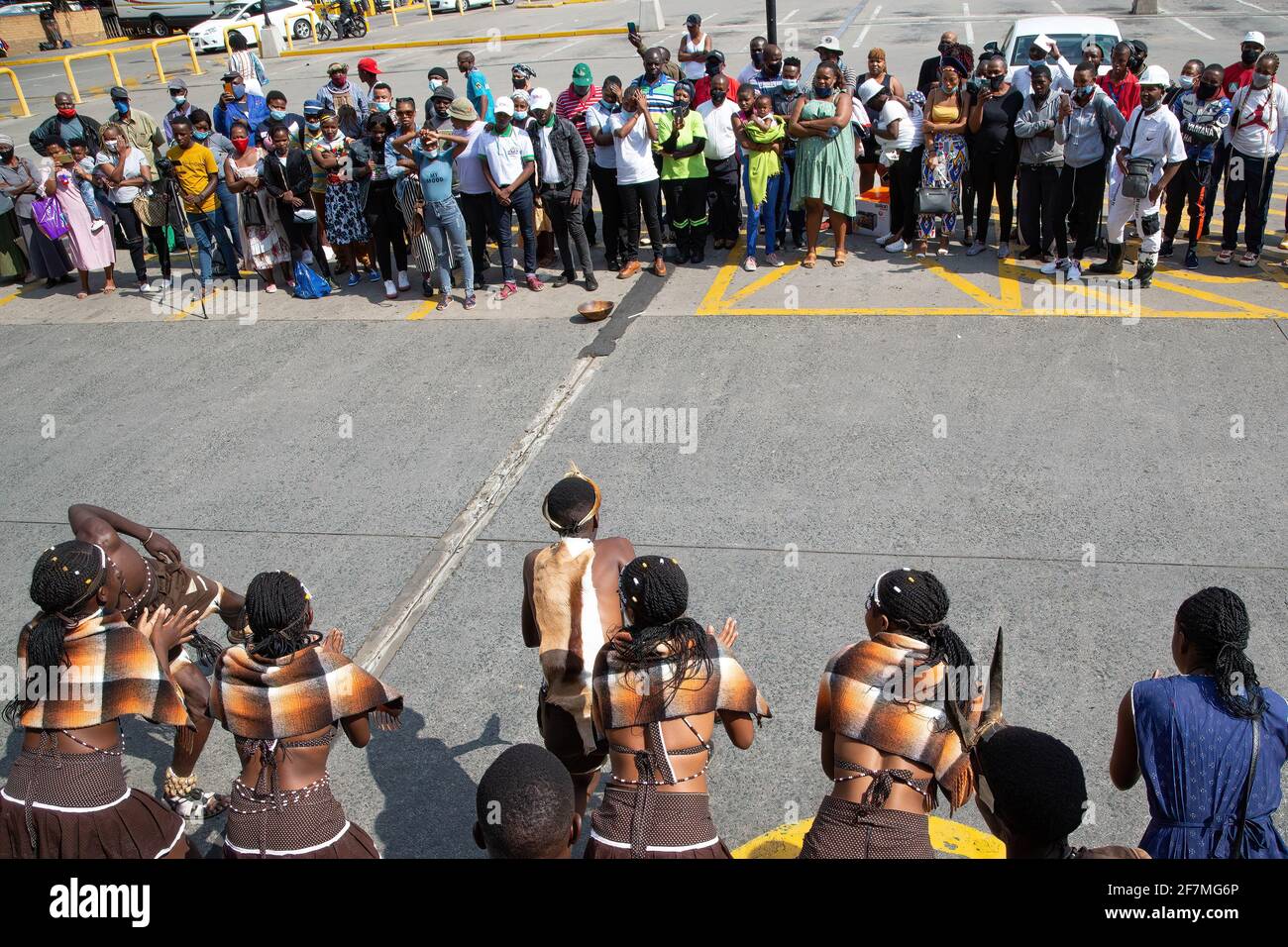 Johannesburg, South Africa. 08th Apr, 2021. People look on as demonstrators dressed in traditional attire dance during a protest outside the Boulders Shopping Centre, after a store manager asked a man to leave for being dressed in the traditional Ndebele attire. Credit: SOPA Images Limited/Alamy Live News Stock Photo