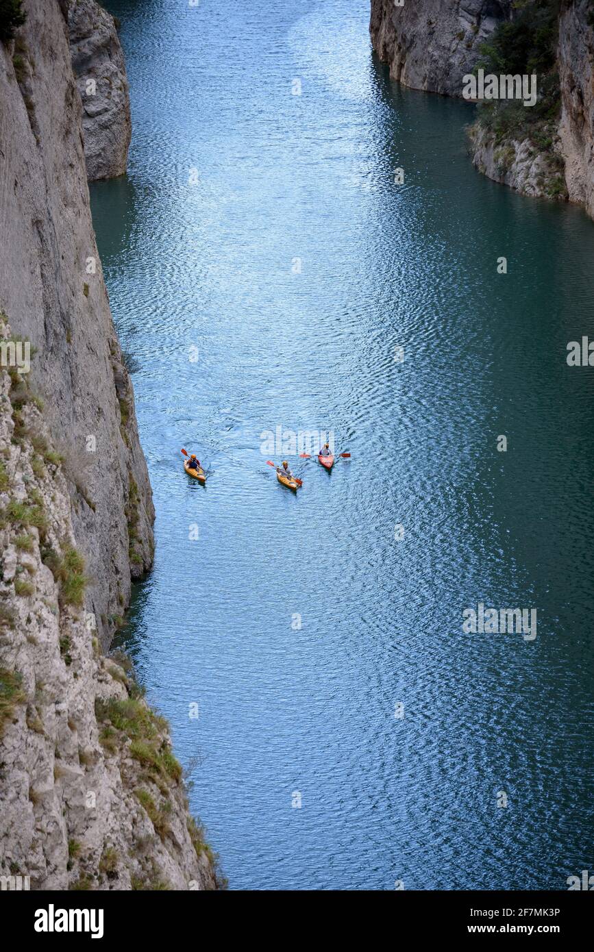 Congost de Mont-rebei gorge, in the Montsec mountain range, with some kayaks on the Noguera Ribagorzana river and the Canelles reservoir Lleida, Spain Stock Photo