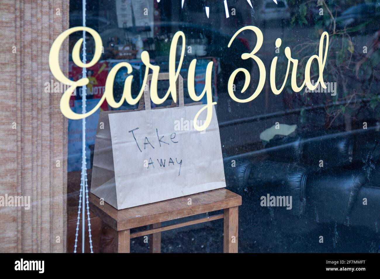 Café Early Bird advertising take away option during restaurant lockdown in Kallio district of Helsinki, Finland Stock Photo