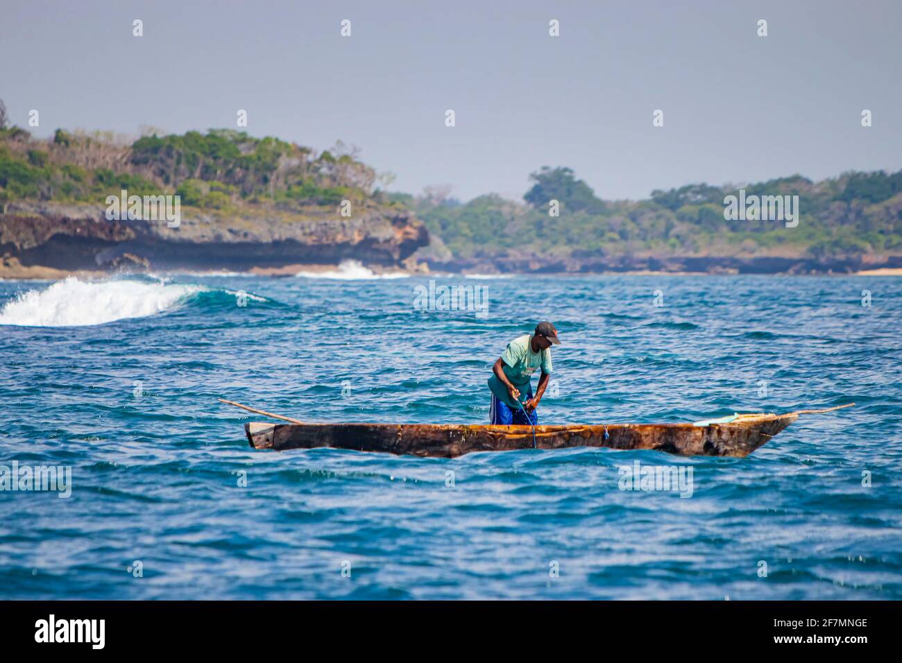 Wasini island, Kenya, AFRICA - February 26, 2020: Fisherman on a typical wooden canoe in the Indian Ocean. Stock Photo
