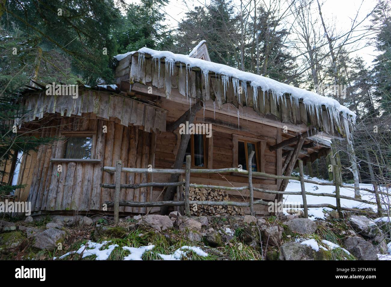 Cottage with stalagtites hanging from the roof. Stock Photo
