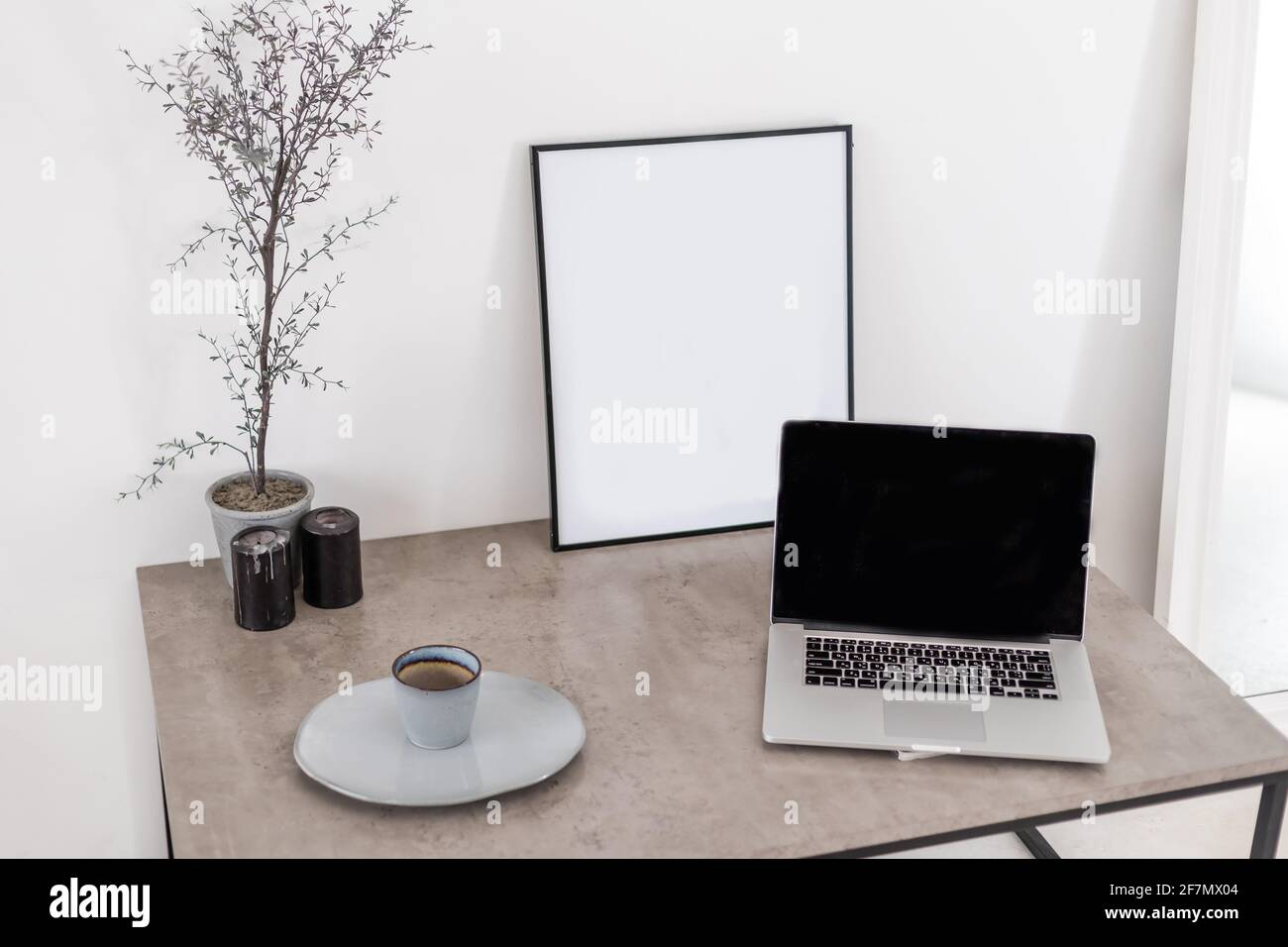 Laptop with blank screen on table Stock Photo