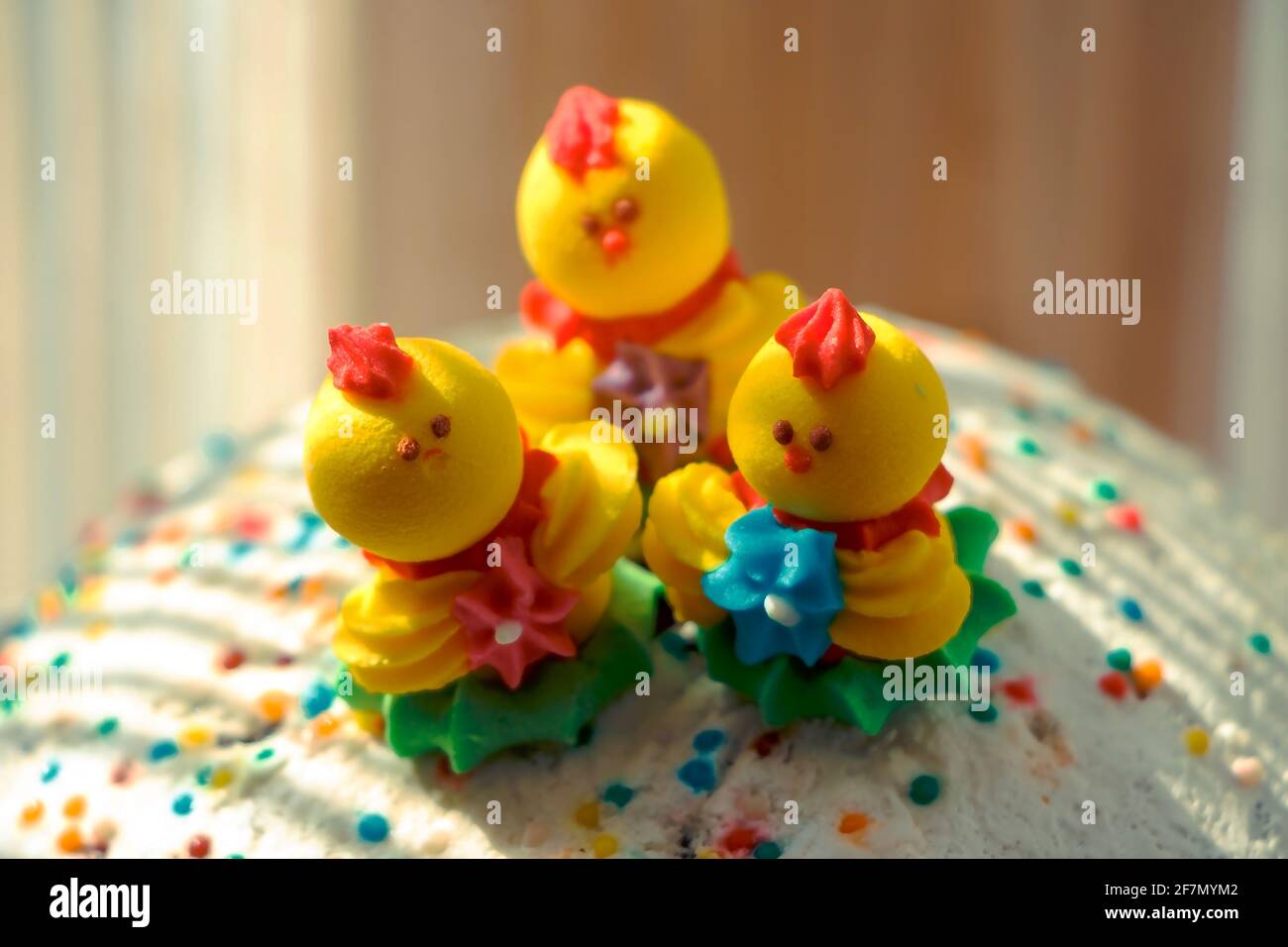 Three pastry miniature chickens on Easter baked goods Stock Photo