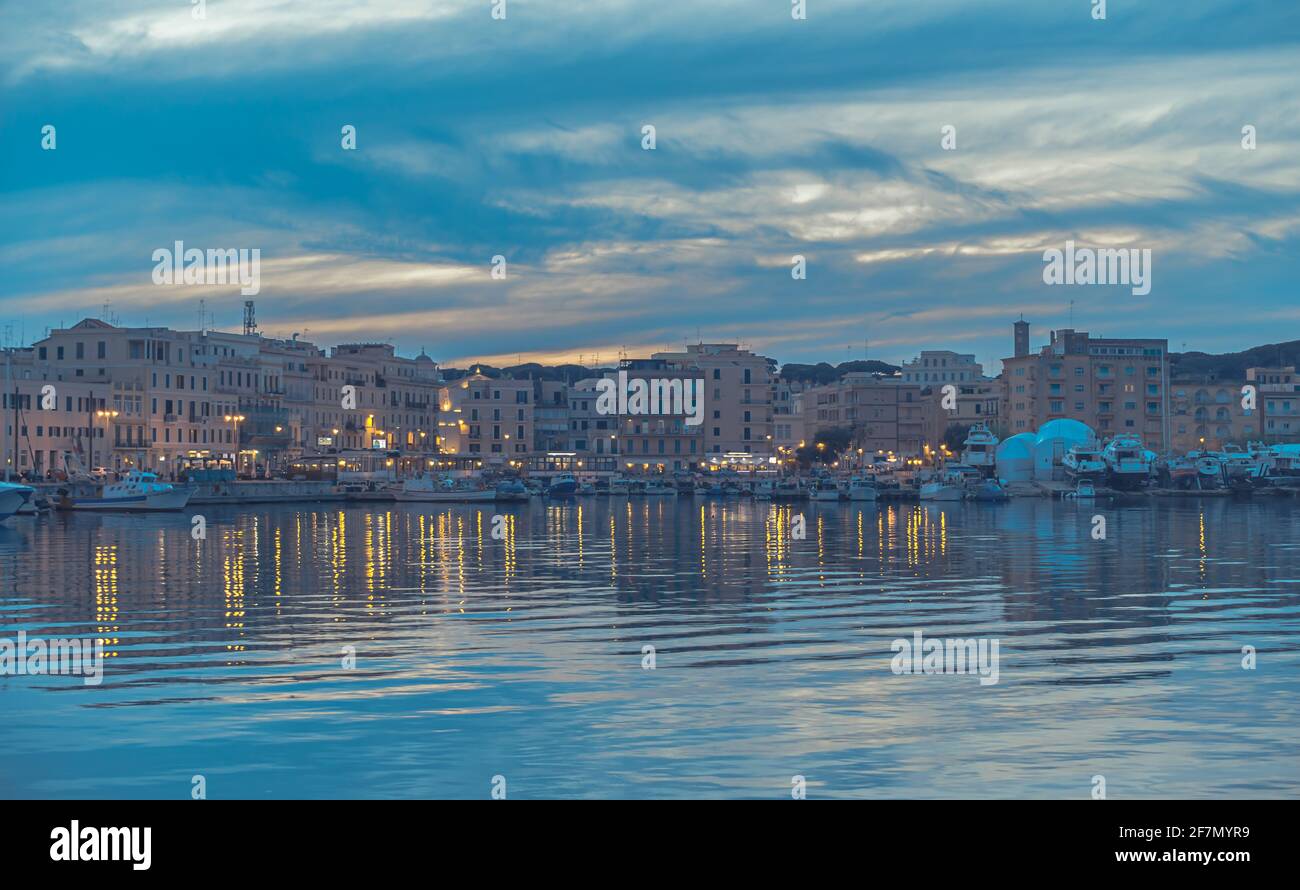 Port of Anzio at sunset and evening lights Stock Photo