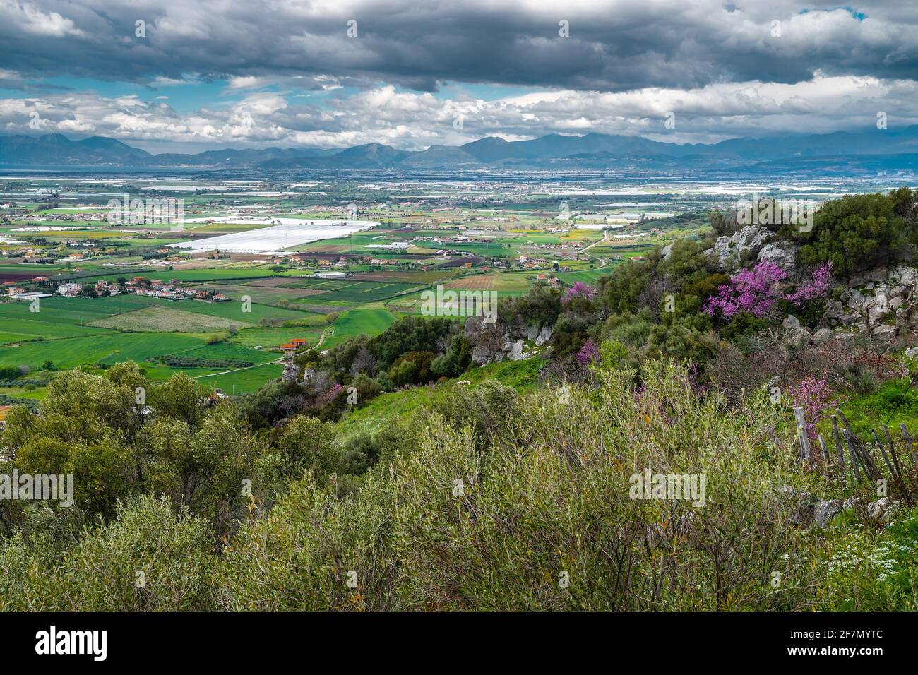 A stunning landscape of southern Italy from a high hill, Madonna del Granato Sanctuary, in April, when the fields emerge green Stock Photo