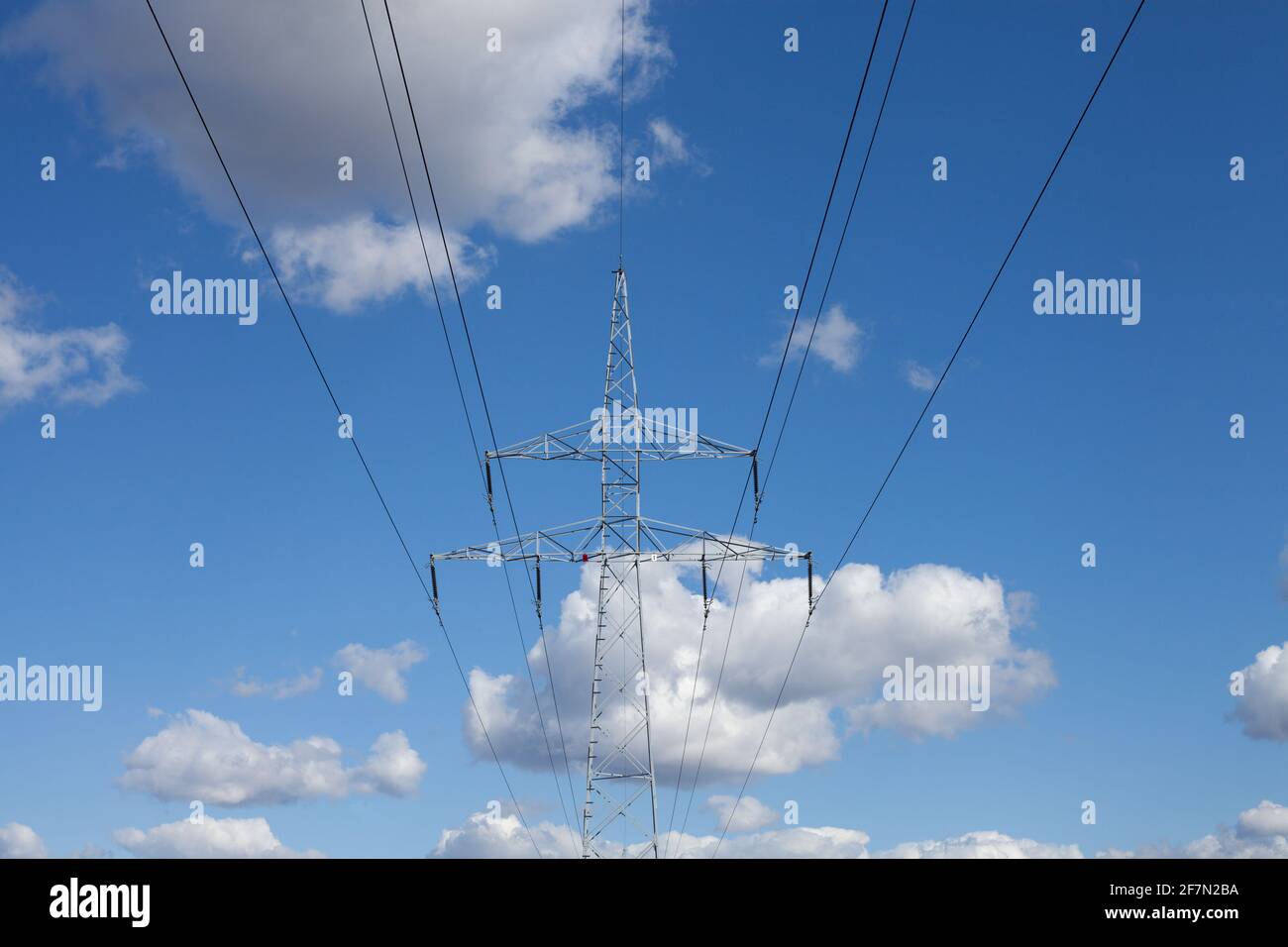 High voltage power lines and blue sky Stock Photo - Alamy