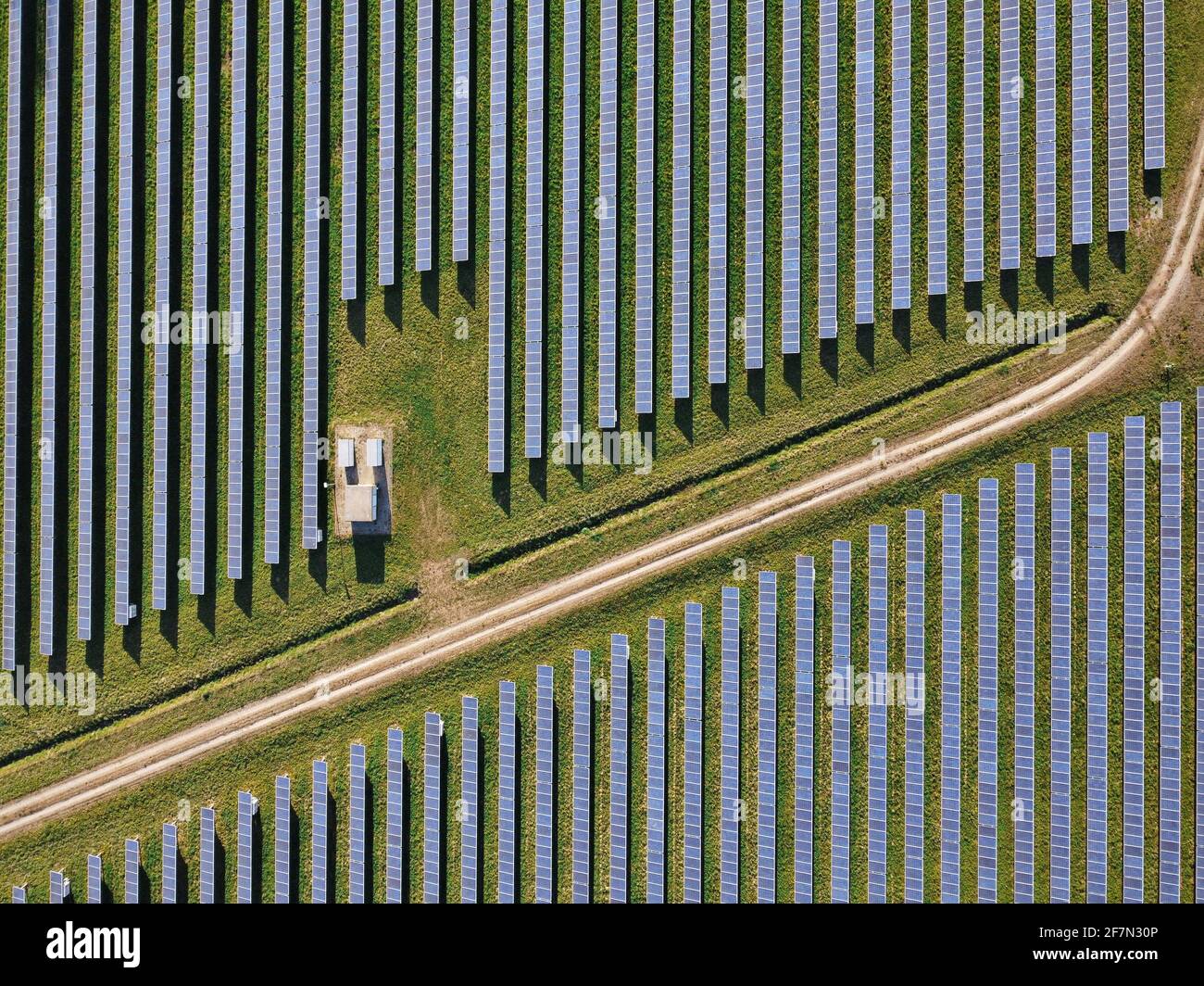 Drone Aerial View power station producing clean, sustainable solar energy  in Italy Stock Photo
