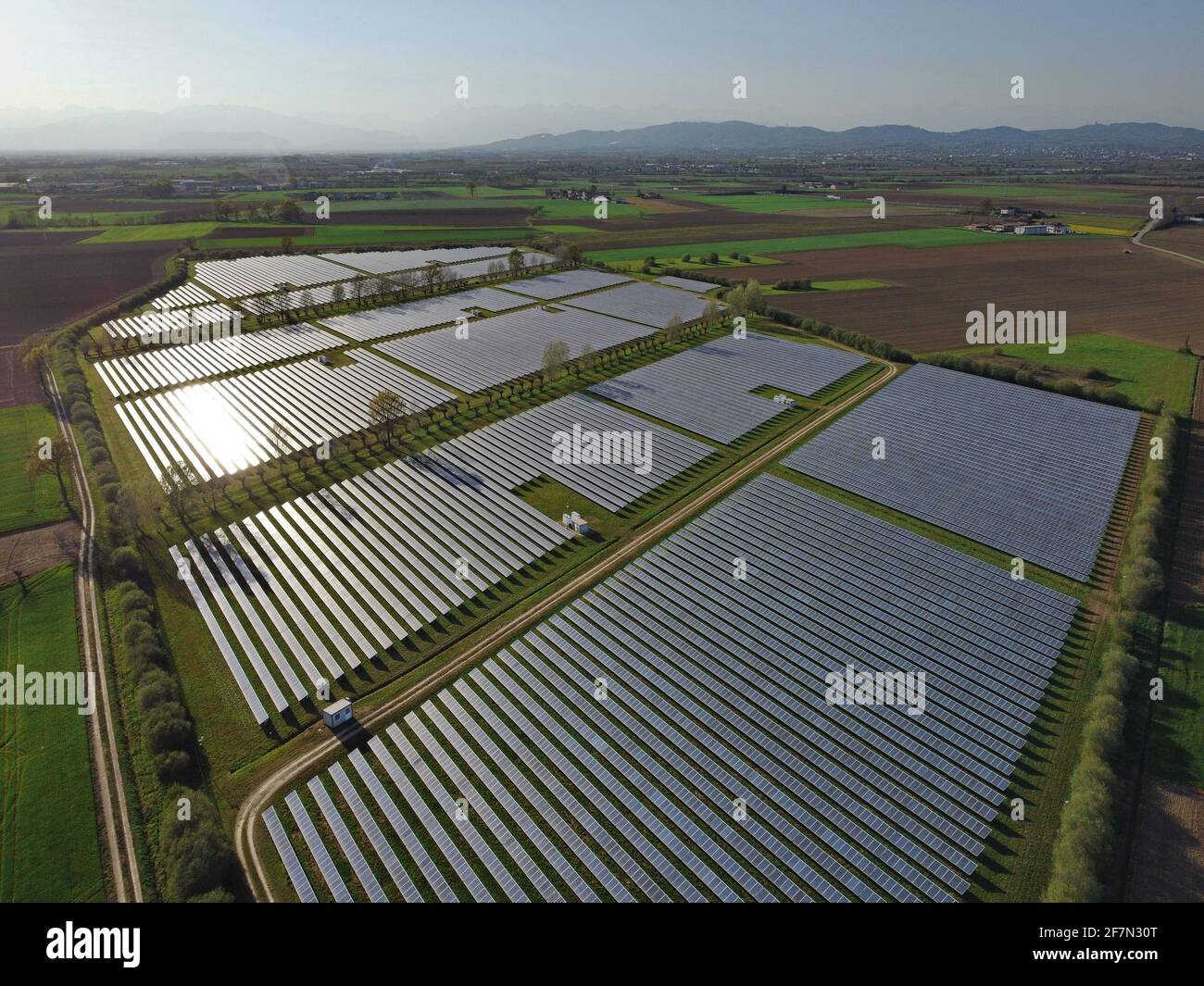 Drone Aerial View power station producing clean, sustainable solar energy  in Italy Stock Photo