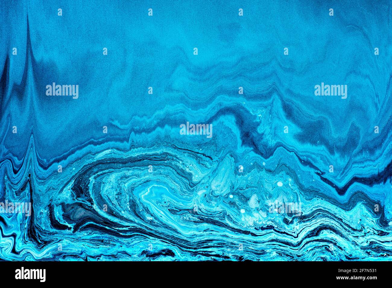 Free flowing blue and white acrylic paint. Random Waves and Curls. Abstract marble background or texture. Stock Photo