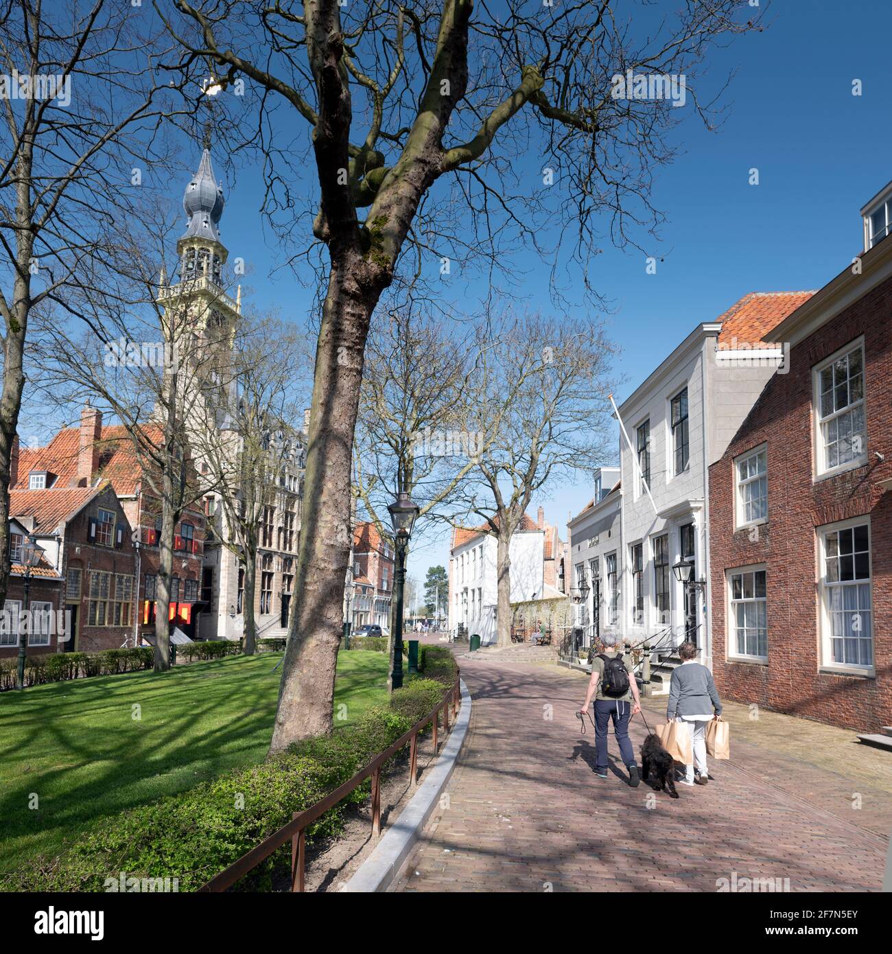 people enjoy sunny spring day in old dutch town of Veere in zeeland Stock Photo