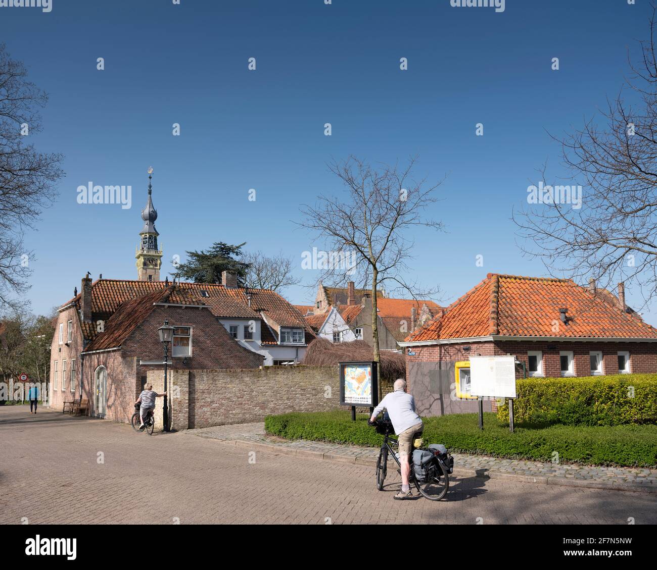 visitors by bicycle in old dutch town of Veere in zeeland Stock Photo