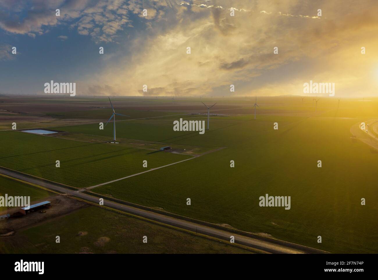 A wind farm at sunset in Texas. Silhouette of wind turbines Stock Photo ...