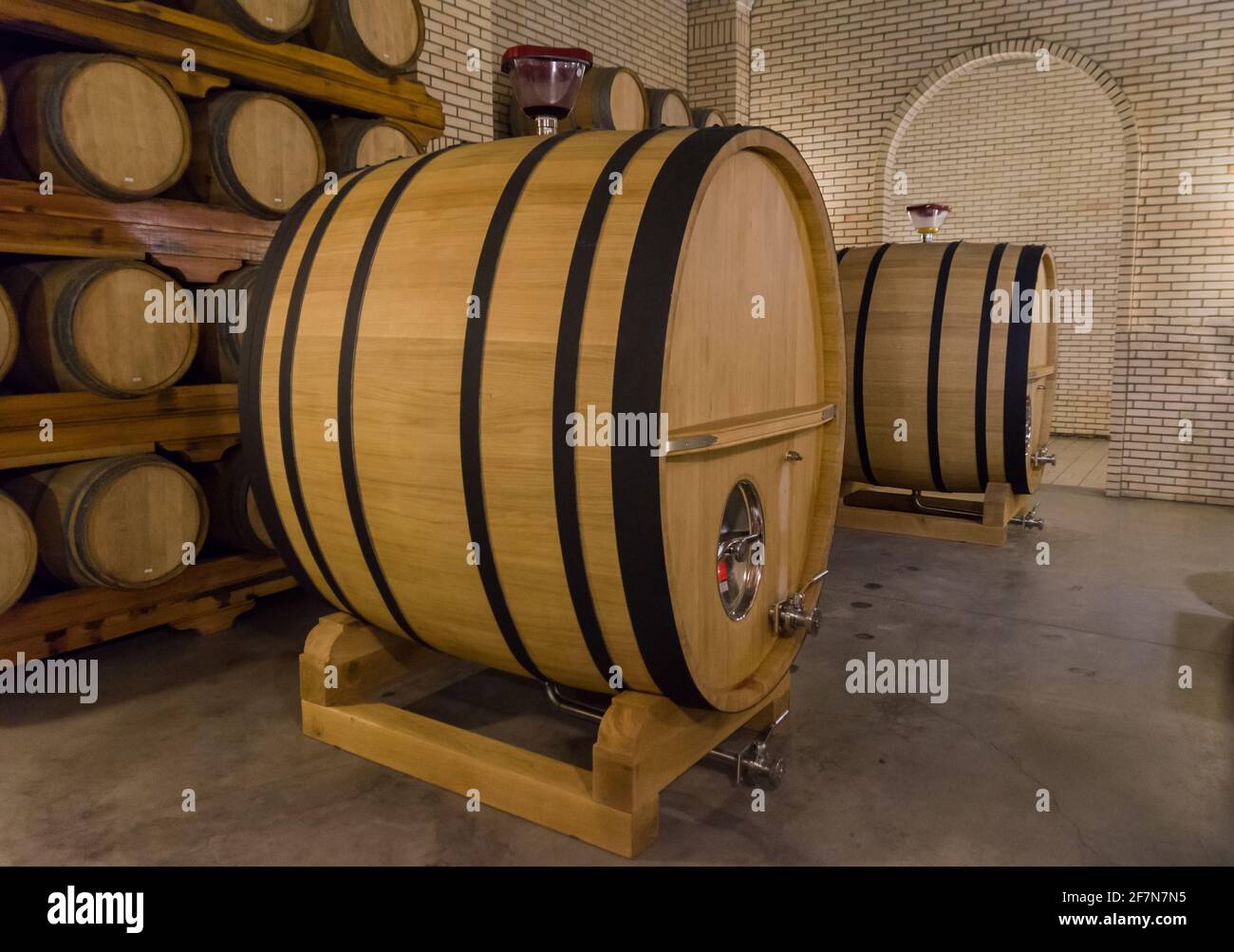 Oak barrels for wine aging in an underground cellar in Vale dos
