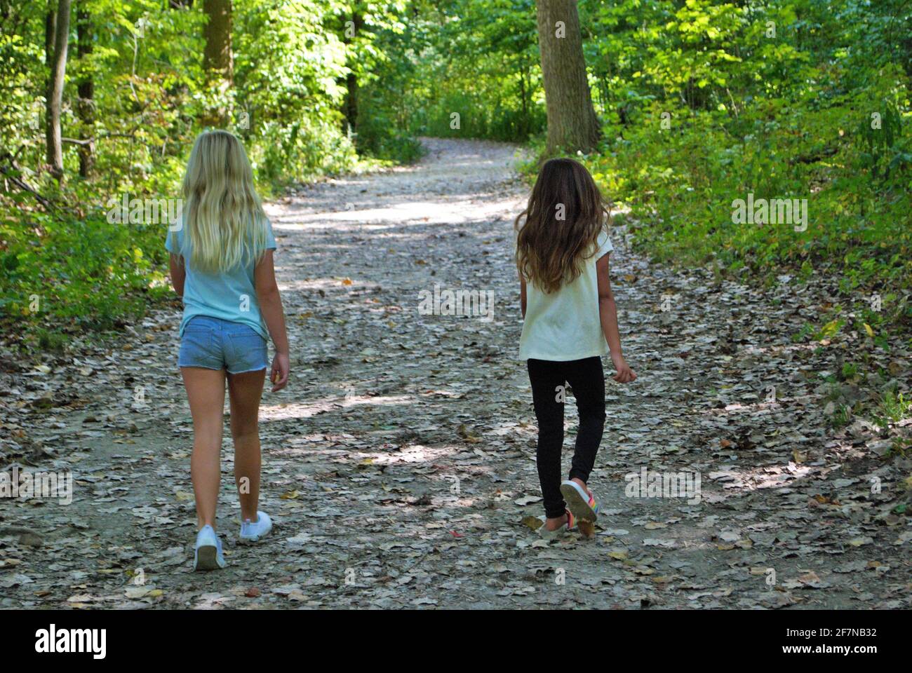 Two girls walking through forest hi-res stock photography and images ...