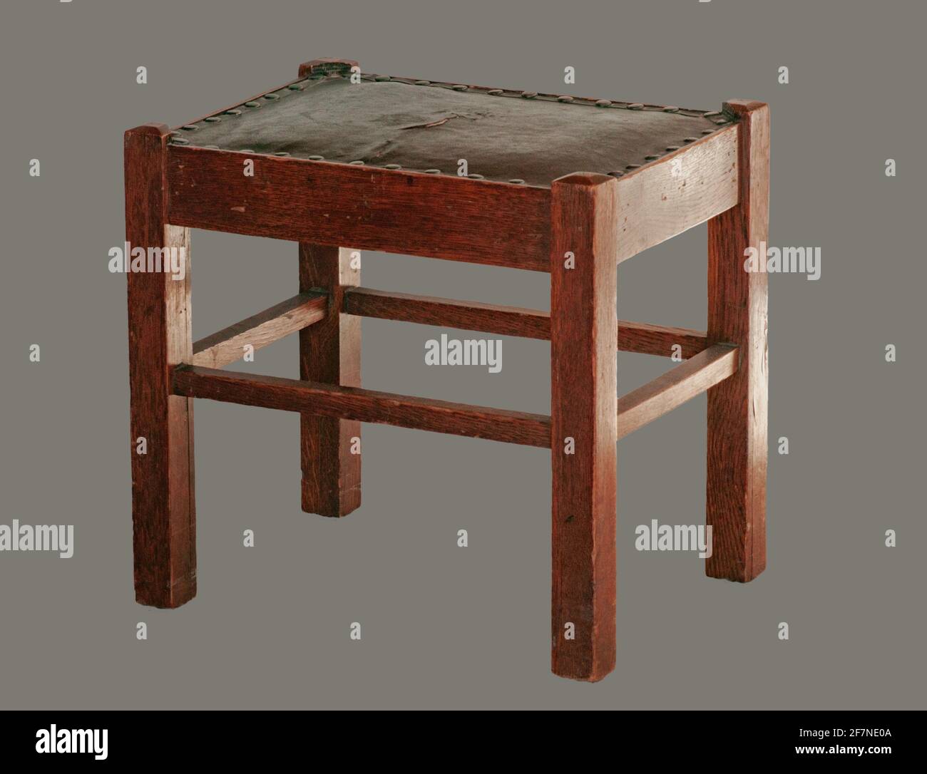 Arts & Crafts Mission Style Craftsman footstool for DIY repair upholstery. Old antique furniture to refurbish and refinish.Isolated. Stock Photo