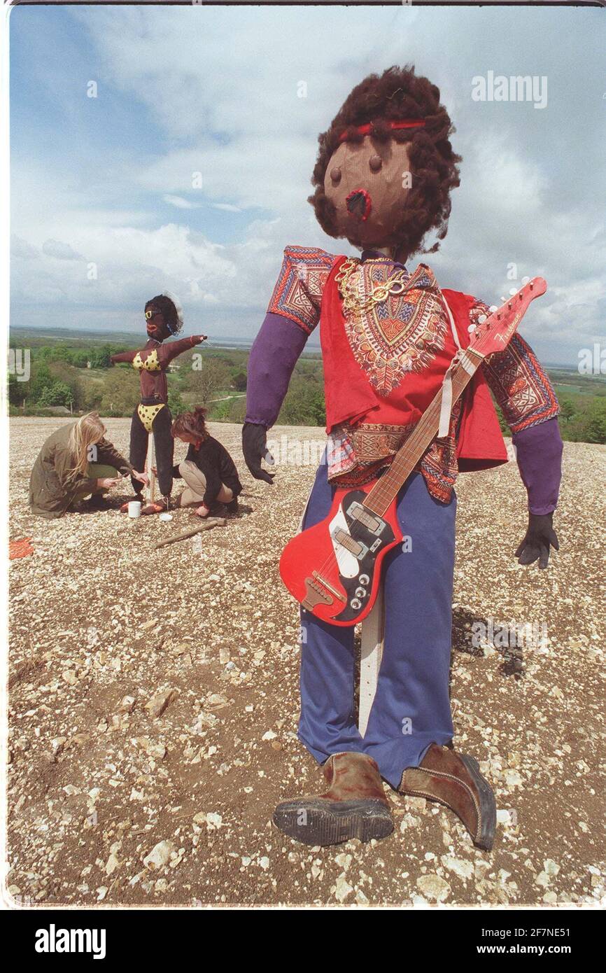 Jimi Hendrix among the figures chosen by teachers on the Isle of Wight when asked to make scarecrows in an Arts Council project to raise pupils rural awareness. Project staff Becky Priest and Rachel Nightingale are putting the finishing touches to the project Stock Photo
