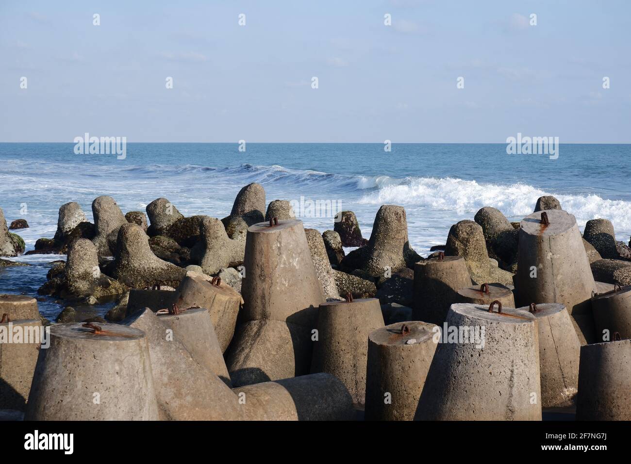 beach with waves breaker concrete, landscape view of the shore Stock