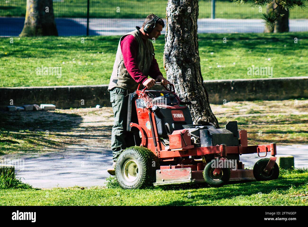Reims France April 08 2021 Gardener standing on a small lawn