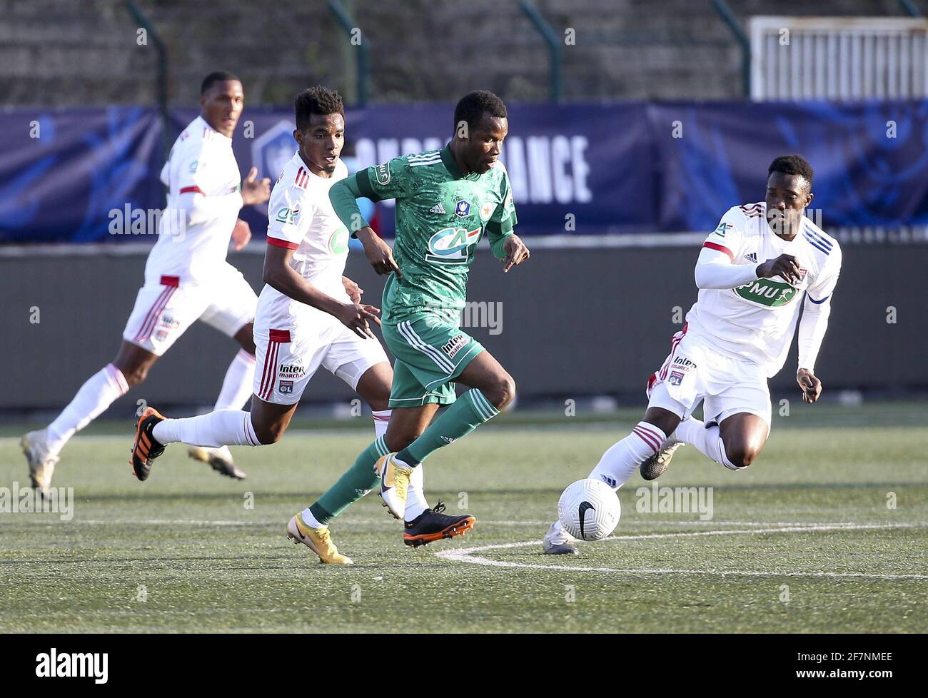 Pape Meissa Ba of Red Star between Thiago Mendes and Sinaly Diomande of Lyon during the French Cup round of 16 football match between Red Star FC and Olympique Lyonnais (OL) on April 8, 2021 at Stade Bauer in Saint-Ouen, France - Photo Jean Catuffe / DPPI / LiveMedia Stock Photo