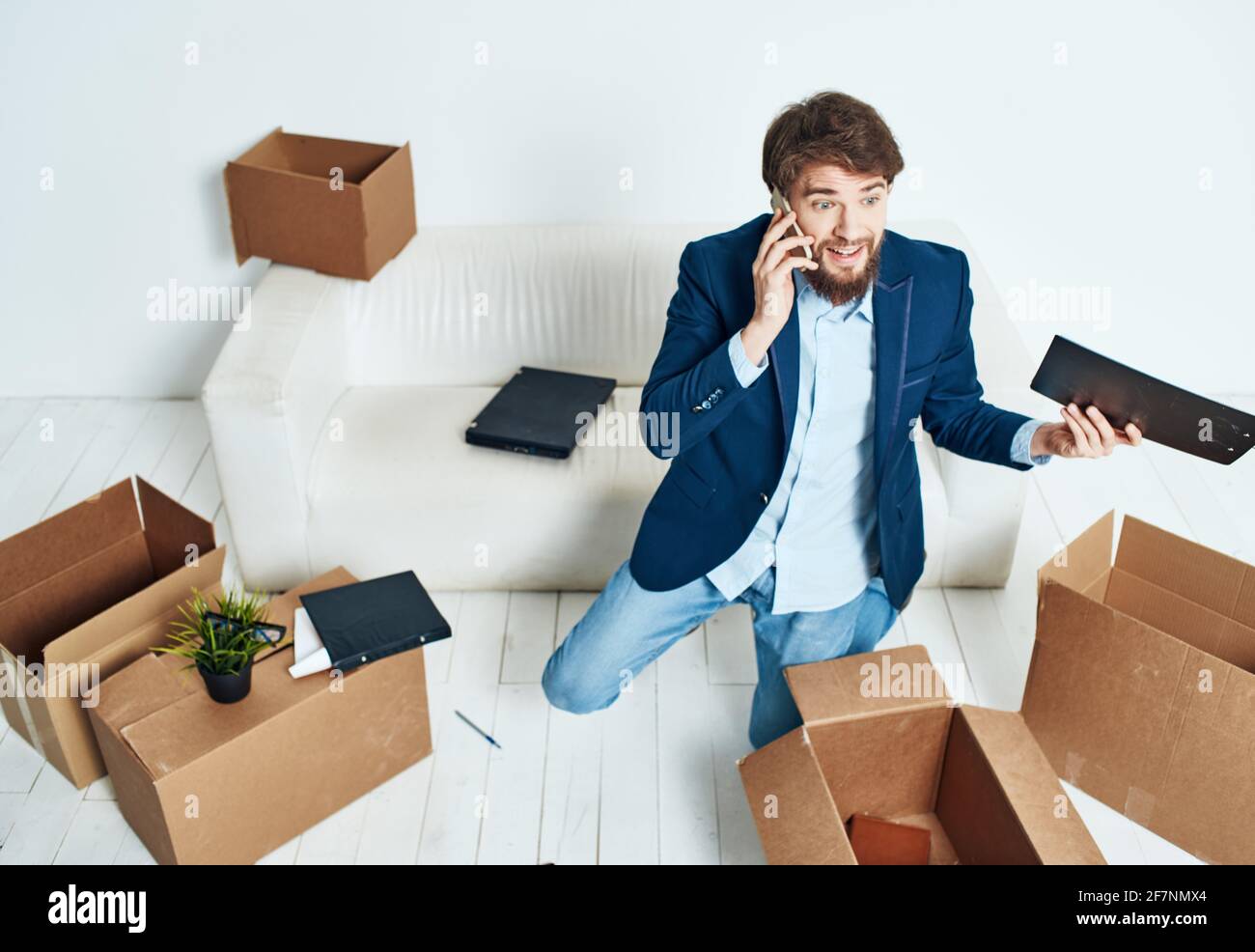 Manager talking on the phone office boxes unpacking emotions of an ...