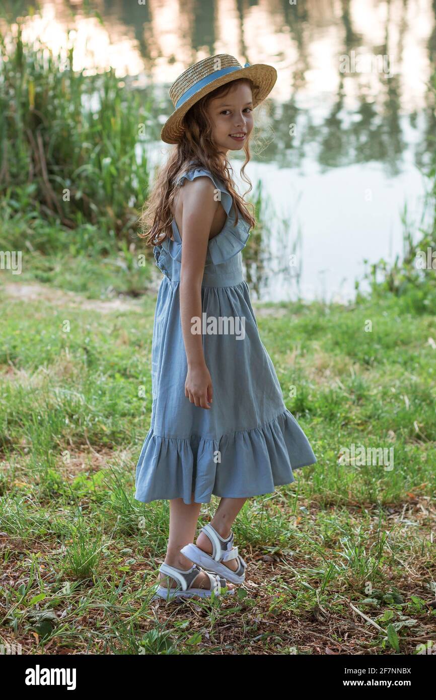 Girl on shore in straw hat hi-res stock photography and images - Alamy