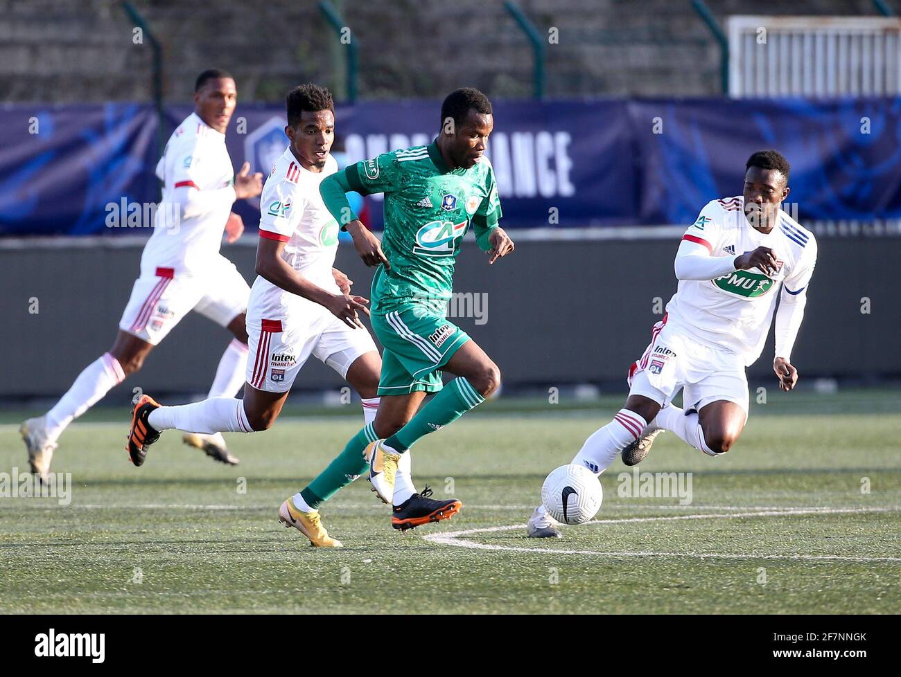 Pape Meissa Ba of Red Star between Thiago Mendes and Sinaly Diomande of Lyon during the French Cup round of 16 football match between Red Star FC and Olympique Lyonnais (OL) on April 8, 2021 at Stade Bauer in Saint-Ouen, France - Photo Jean Catuffe / DPPI Stock Photo