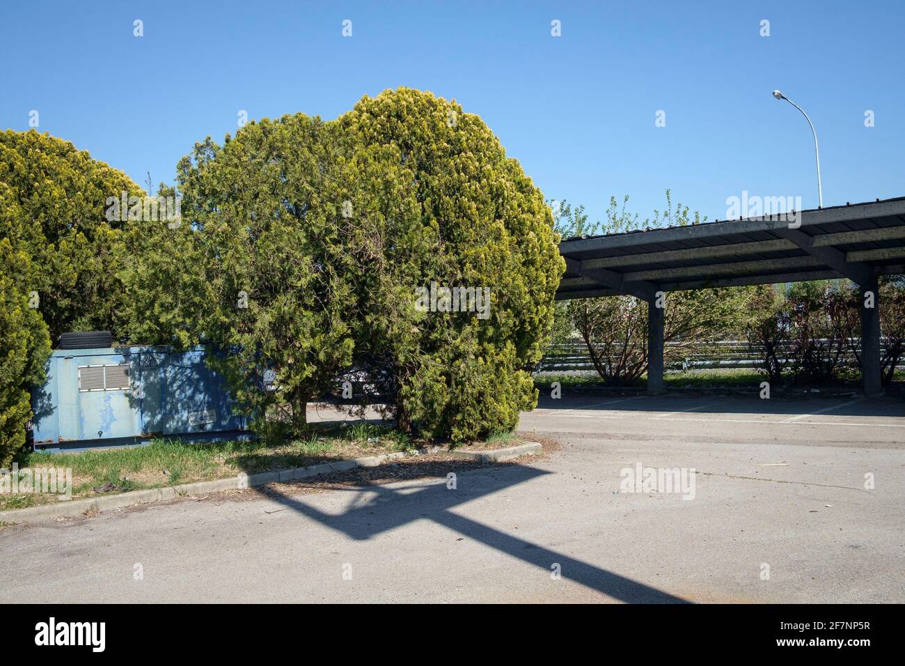 Parking lot in the outskirts of Milano, Italy Stock Photo