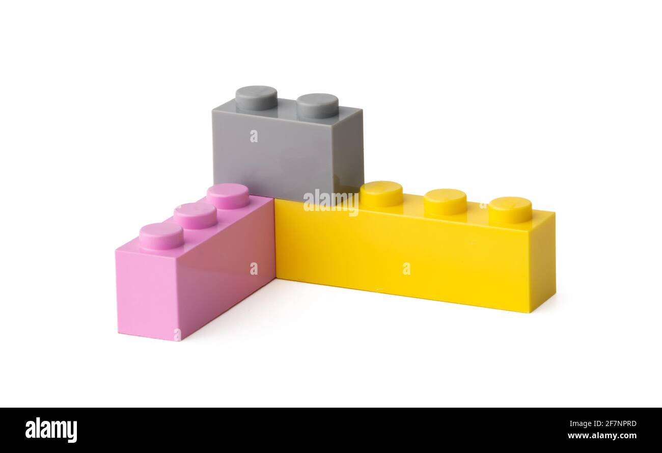 Colorful plastic toy building blocks isolated on white Stock Photo - Alamy