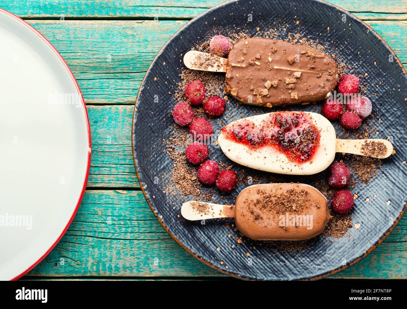 Ice cream on sticks with chocolate.Chocolate covered ice cream with cherry jam Stock Photo