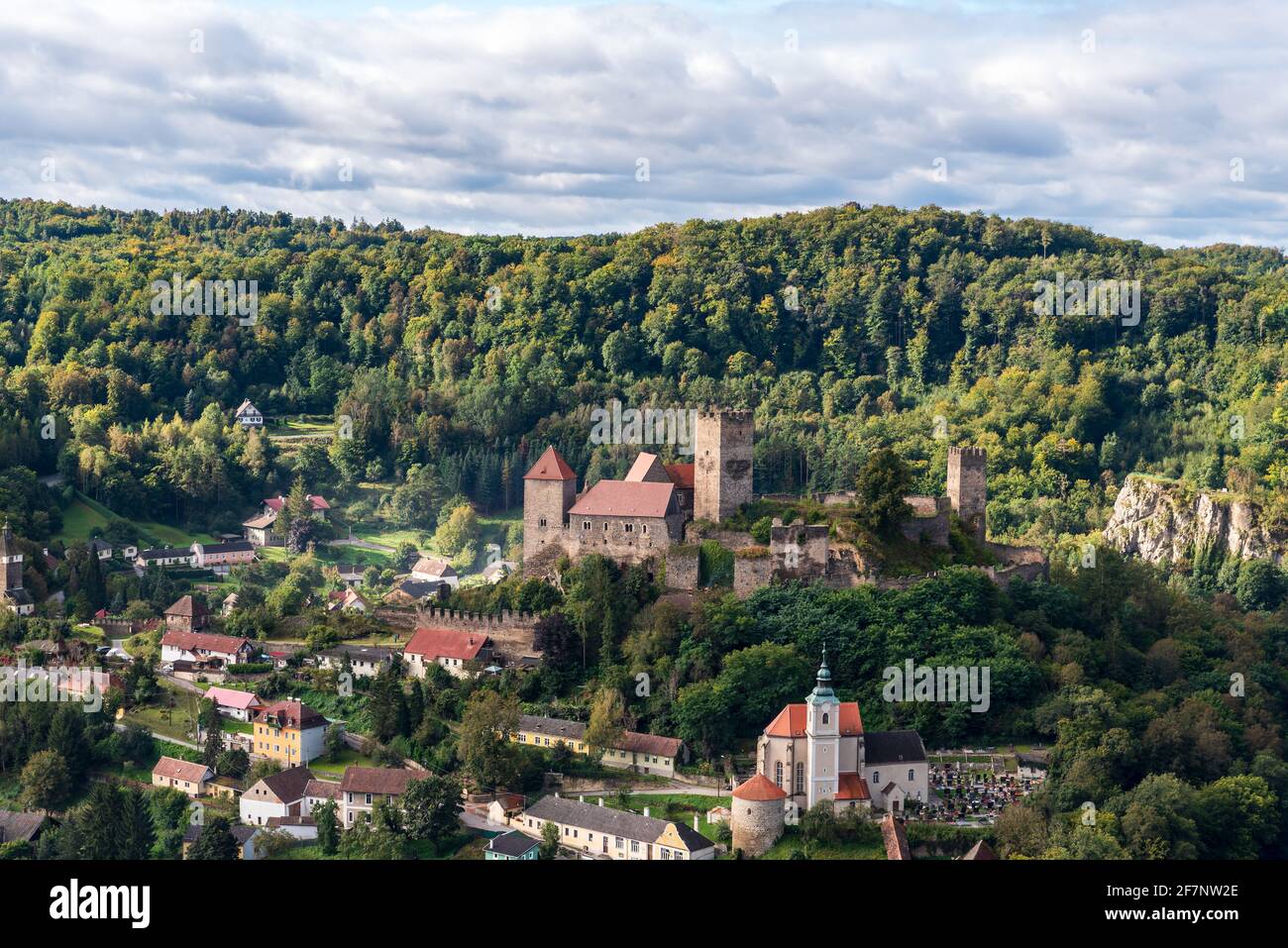 Hardegg town with castle ruins and church in Austria from Hardeggska vyhlidka view point in Podyji National park in Czech republic during autumn morni Stock Photo