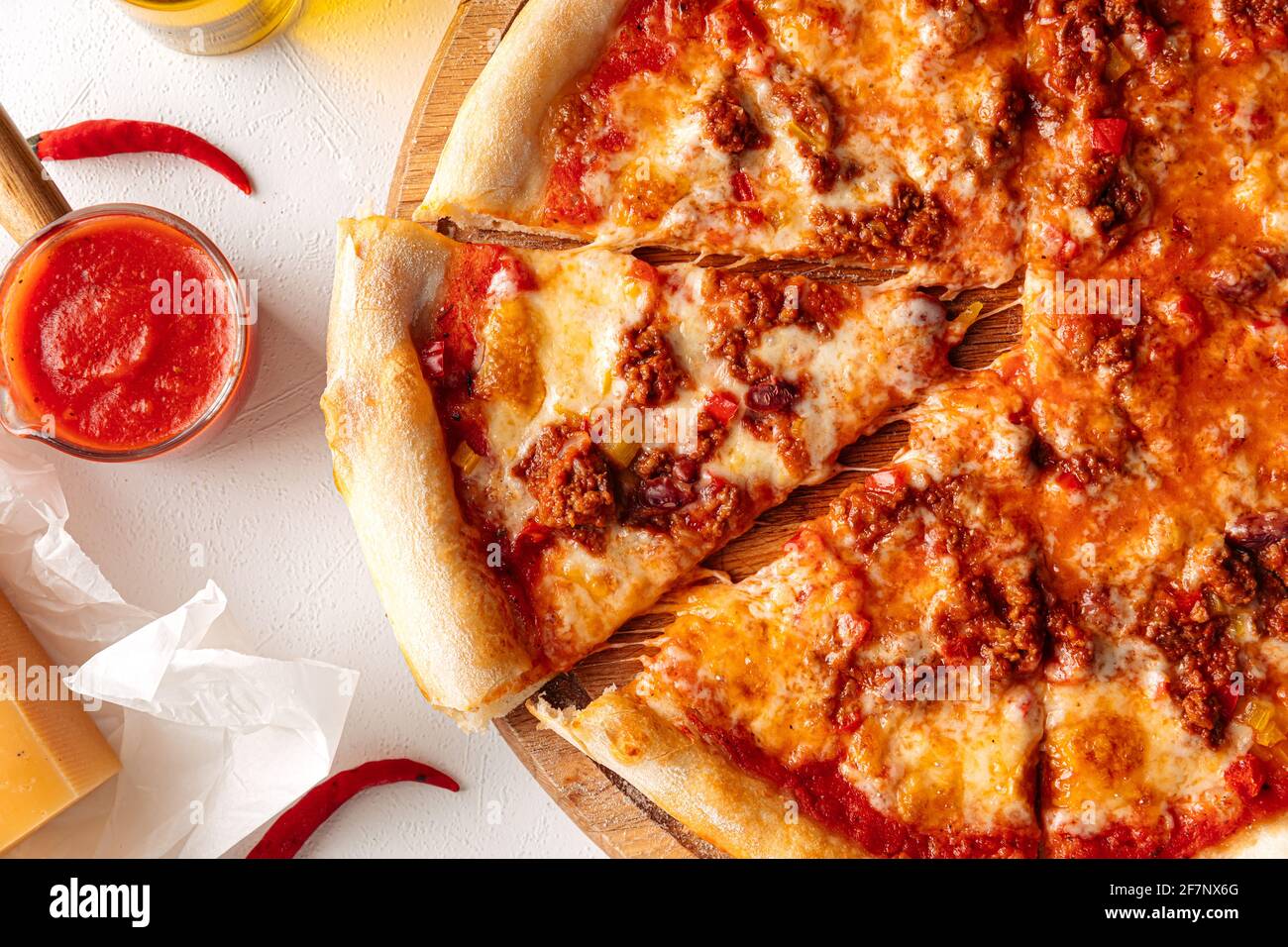 Sliced hot spicy pizza with minced meat Stock Photo