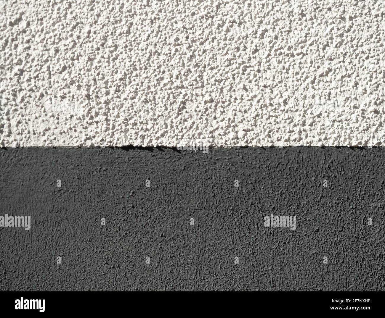 rough white wall textures with harsh sunlight highlighting the texture Stock Photo
